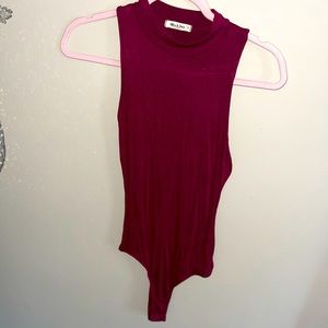 Never worn, burgundy sleeveless bodysuit, size small